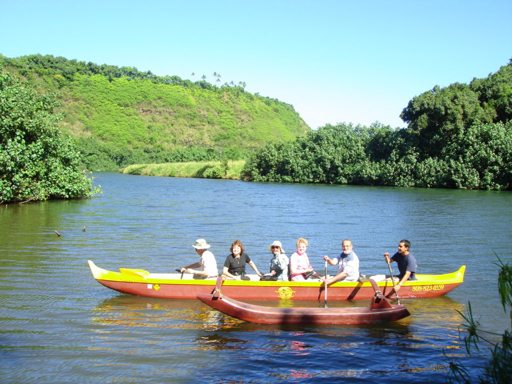 Tourists in canoe boat on Wailua River