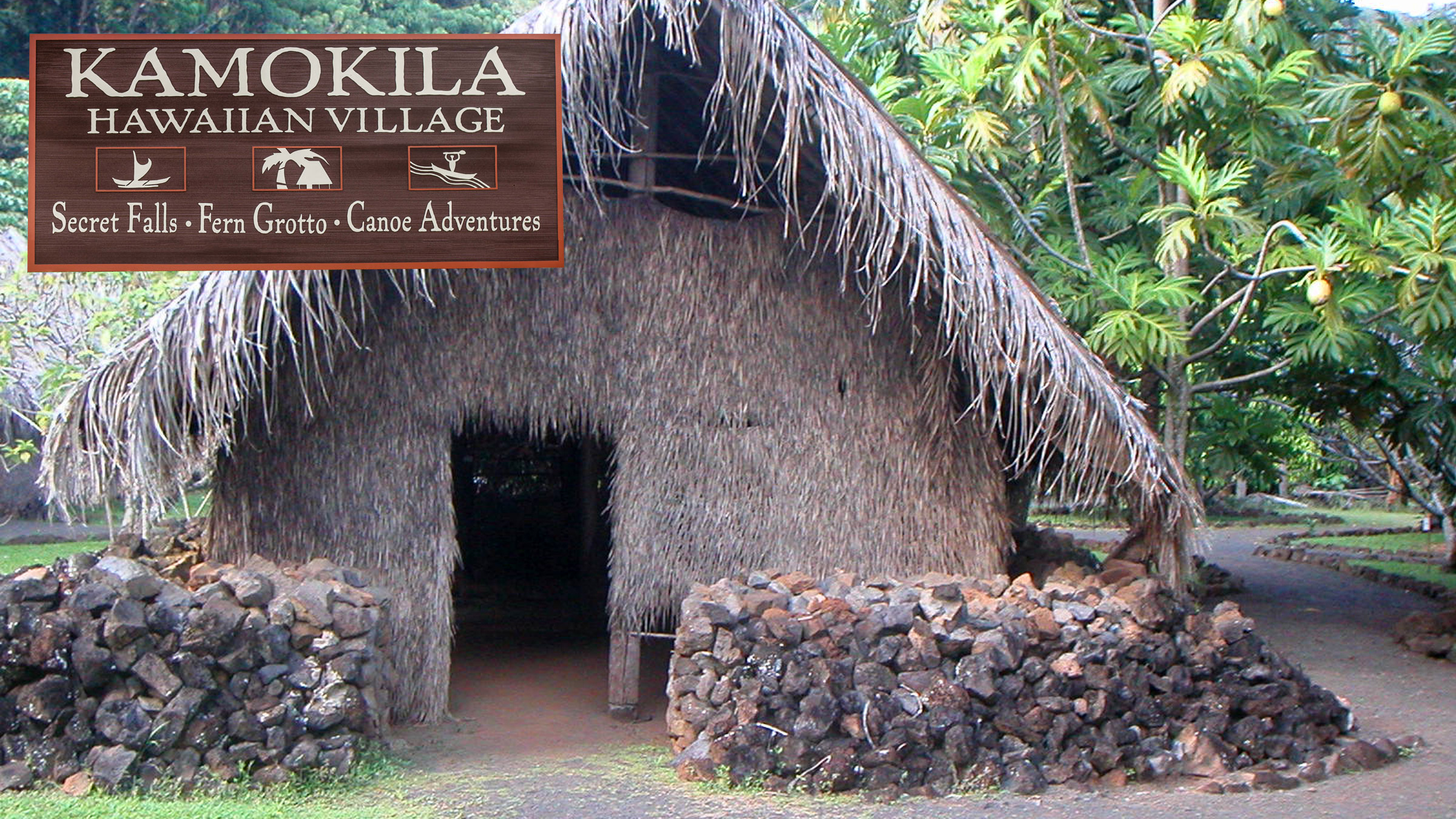 Hawaiian tiki hut stone foundation tropical vegetation